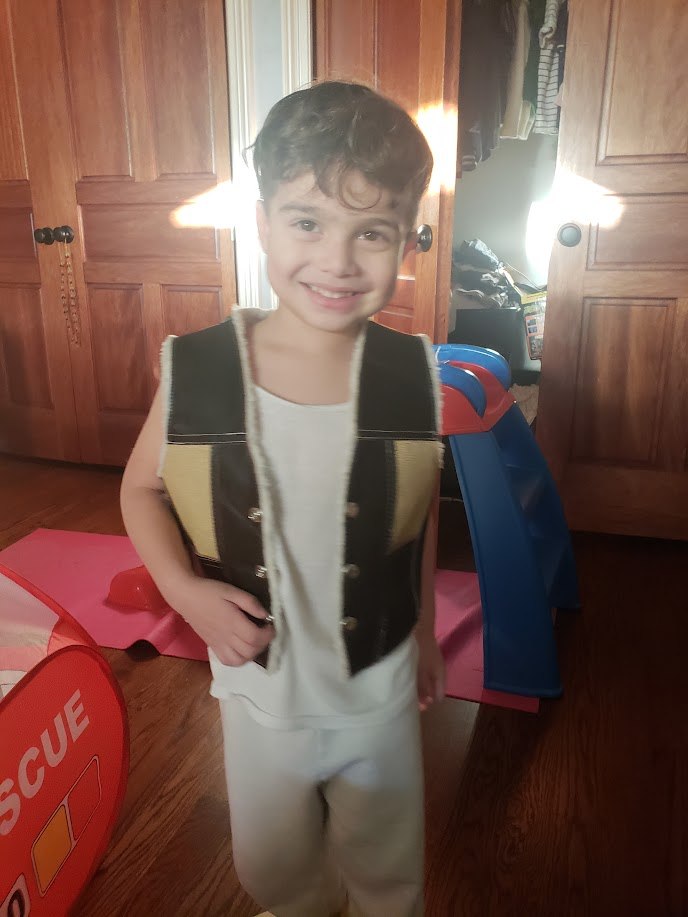 Ares dressed for imaginative play as a young child